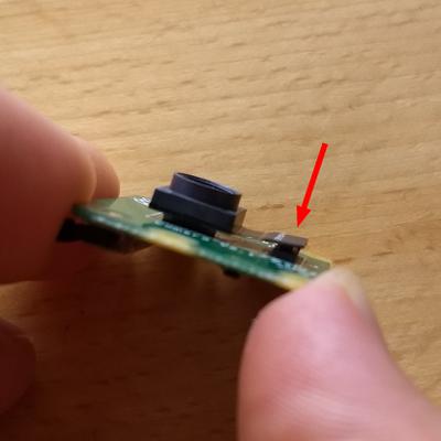 The small ribbon cable from the sensor is to the right.
